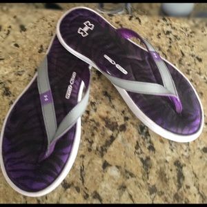Women’s purple/white and gray UA flip flops